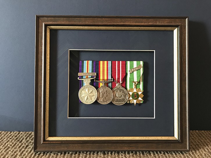 War medals displayed in a frame
