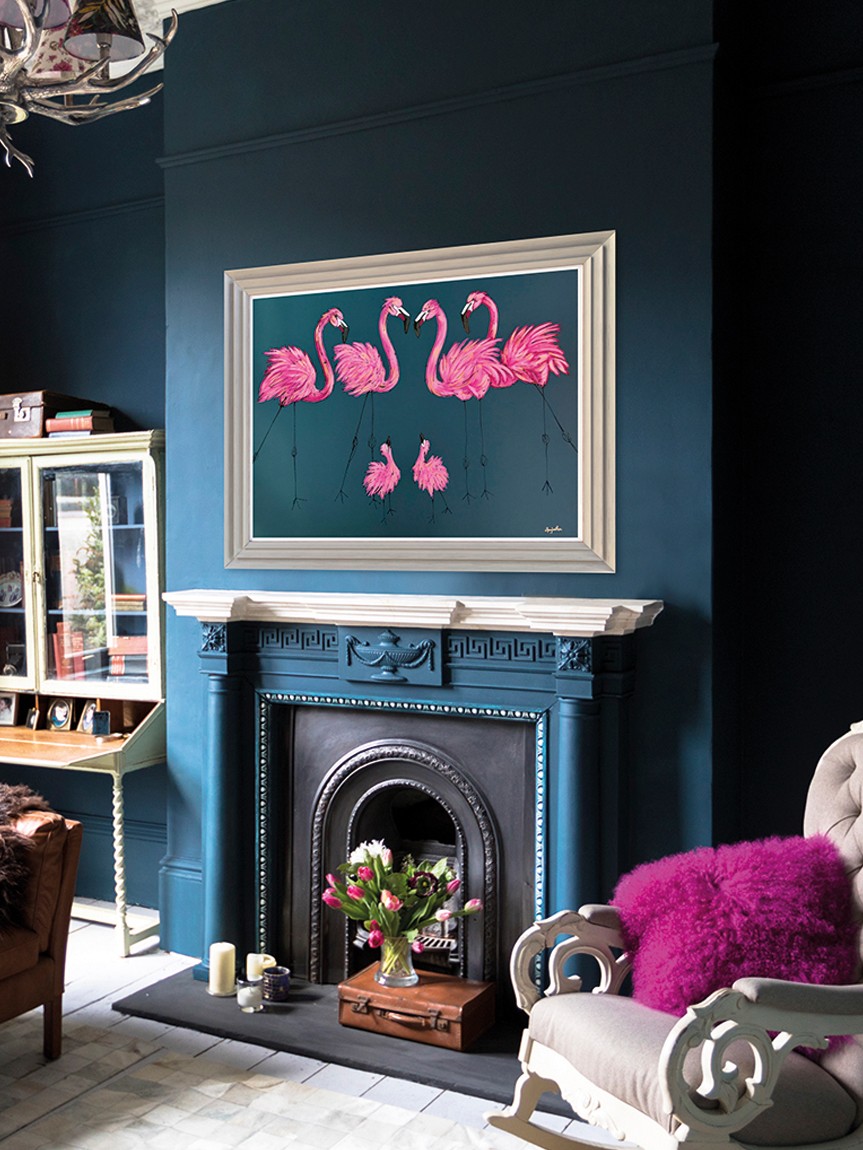 Painting of flamingos over a fireplace