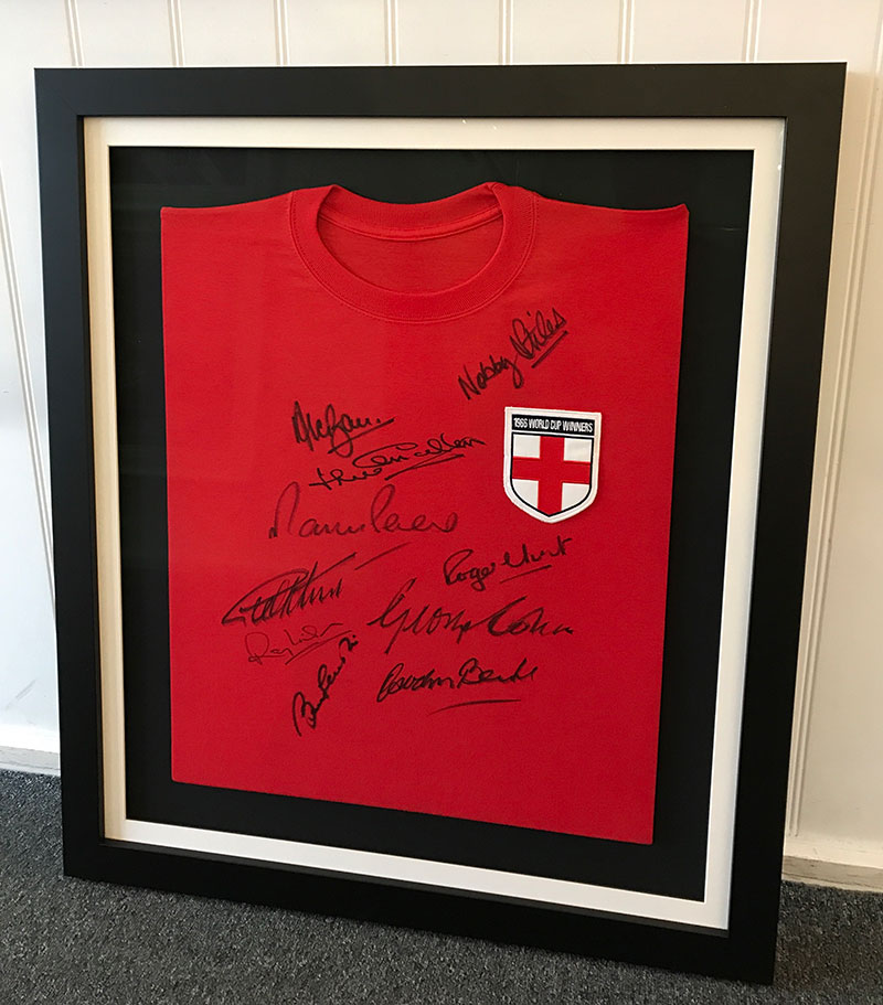 Signed red 1966 world cup winners t shirt