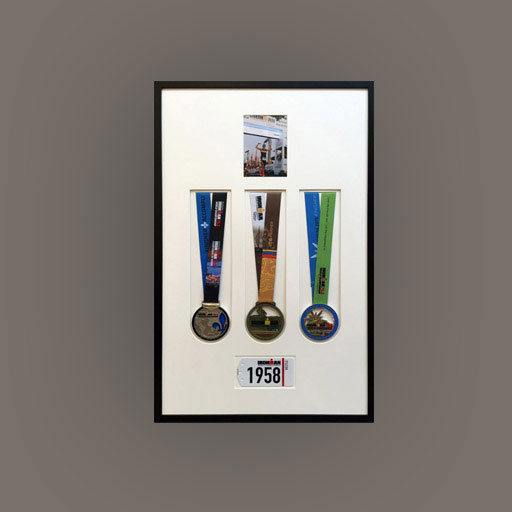 3 medals displayed in a black frame
