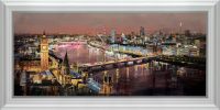 Glowing places a painting by Tom Butler. a night time city scape of the surrounding city/river around Big Ben in a white frame