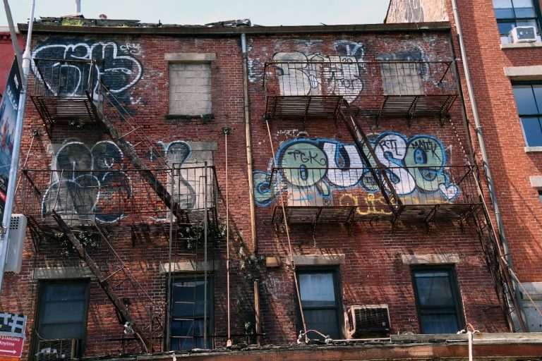 Early street art on the side of a building in Manhattan