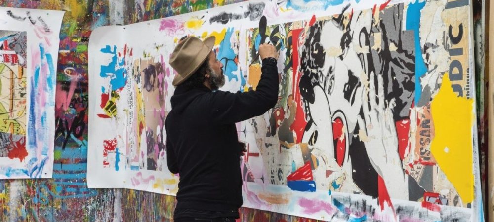 Mr Brainwash creating one of his pieces