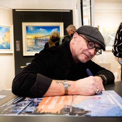 Mark Curryer signing a poster at the meet Mark Curryer event